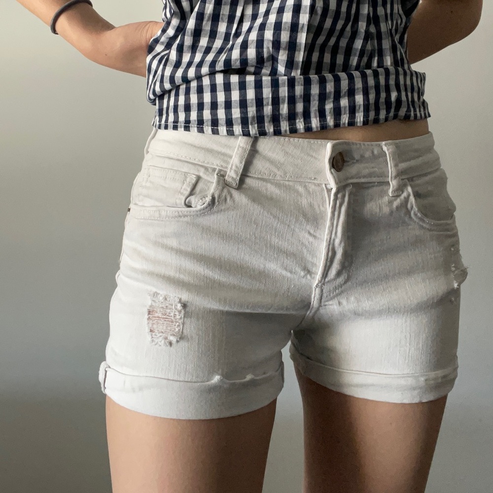 white ripped short jeans